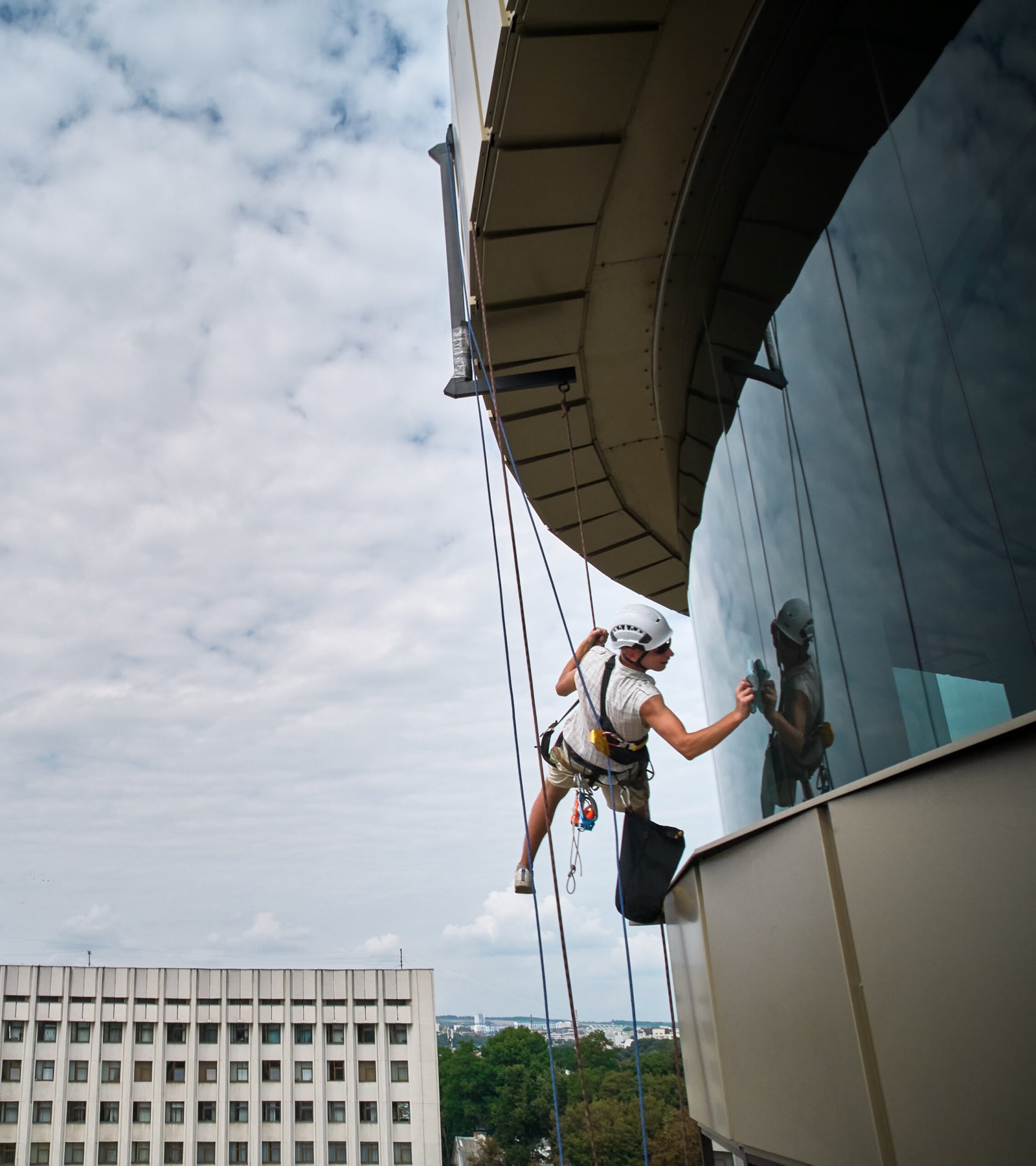 A cleaner using special products to remove mineral buildup from windows.