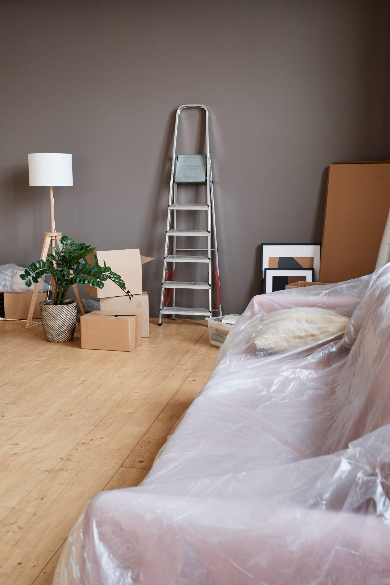 A professional cleaner wiping down mirrors, sinks, and tiles in a new home.